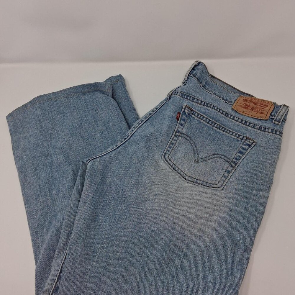 Levi's 515 lighwash bootcut jeans women's size 14 with few stains a distressed